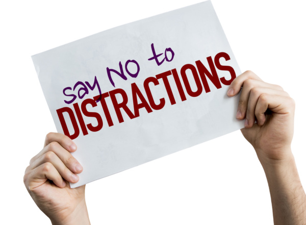 A sign with the words "Say No To Distractions" is shown on a white background. Concept, Why do I yawn when I pray?