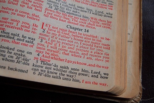 The Bible is opened to John 14:1, and the phrase "Let not Your heart be troubled" is written. Concept, meditating on God's Word.