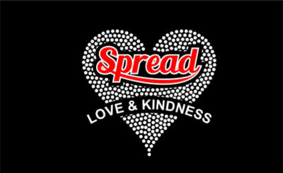 On a black backdrop, a heart with white polka dots containing the phrase "Spread Love & Kindness" in its center is visible. Concept spreading love and kindness.