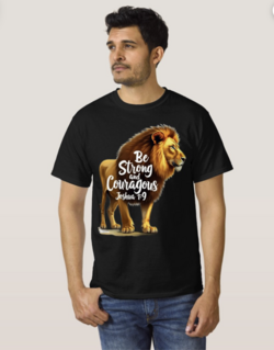 Man wearing a black t-shirt featuring a majestic lion and the Bible verse 'Be Strong and Courageous Joshua 1:9', illustrating how Scripture provides spiritual strength and protection for families facing life's challenges. The powerful imagery of the lion represents courage and divine protection mentioned throughout the Bible.